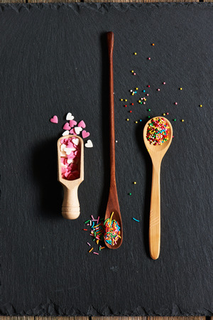 Sugar sprinkle dots on slate backgroundの写真素材