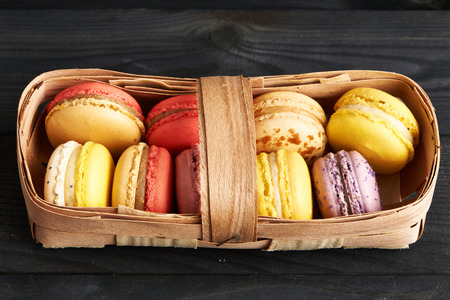 French delicious dessert macaroons in basketの写真素材