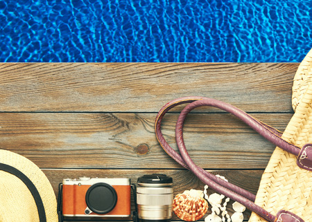 Travel and beach items at poolの写真素材