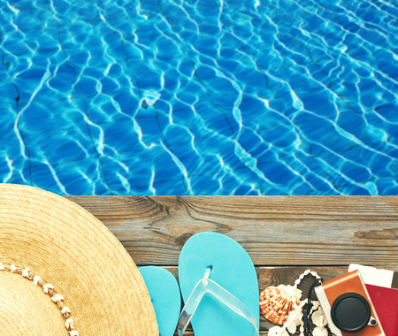 Travel and beach items at pool