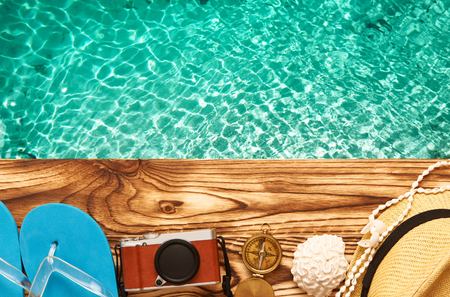 Travel and beach items at jettyの写真素材