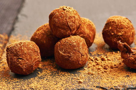 Homemade chocolate truffles on slate plate