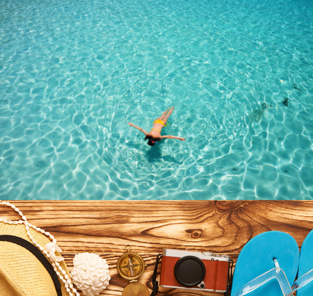 Travel and beach items at jettyの写真素材