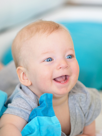 Six months old baby with blue eyesの写真素材