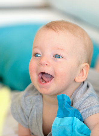 Six months old baby with blue eyesの写真素材