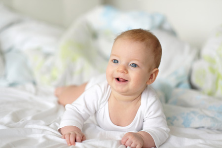Four months old baby with blue eyesの写真素材