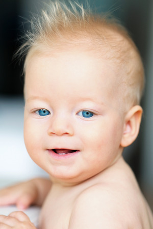 Baby boy with blue eyes portraitの写真素材