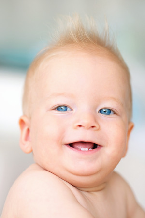 Baby boy with blue eyes portraitの写真素材