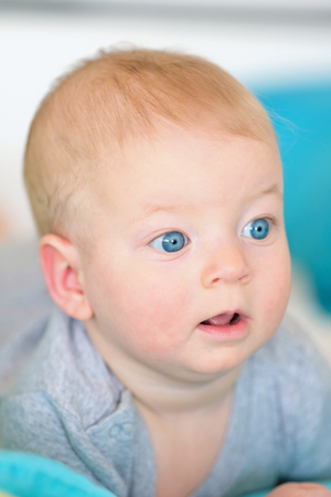 Six months old baby with blue eyesの写真素材