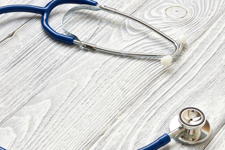 Stethoscope on white wooden backgroundの写真素材