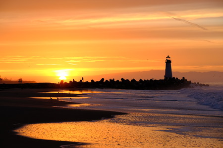 Santa Cruz Breakwater Light (Walton Lighthouse) at sunrise, Pacific coast, California, USAの写真素材