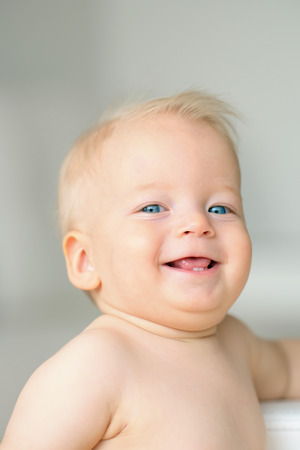 Baby boy with blue eyes portraitの写真素材