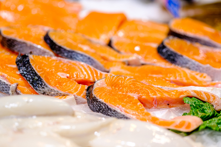 Fresh salmon on cooled market displayの写真素材