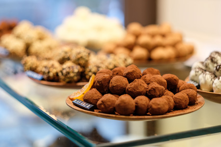 Chocolate truffle candies in confectionery storeの写真素材