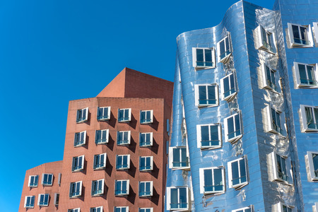Closeup view of Frank Gehry's famous modern buildings at Neuer Zollhof in Dusseldorf, Germany.の写真素材