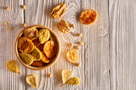 Dried fruits on vintage rustic wooden background の写真素材
