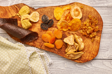 Dried fruits on vintage rustic wooden background の写真素材
