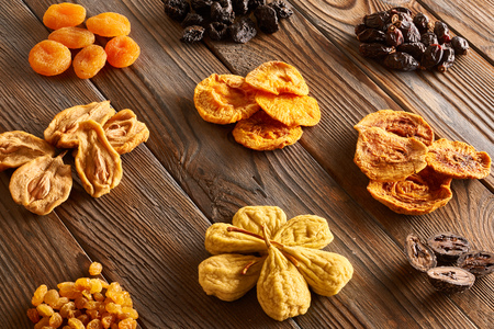 Dried fruits on vintage rustic wooden background の写真素材