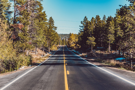 Season changing from autumn to winter. Highway in Colorado, USA.の写真素材
