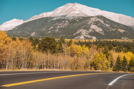 Season changing from autumn to winter. Highway in Colorado, USA.の写真素材