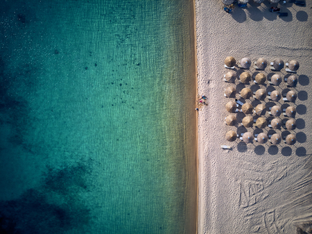Beautiful beach with family top aerial view drone shot, Sithonia, Greeceの写真素材