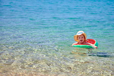 Two year old toddler boy on beachの写真素材