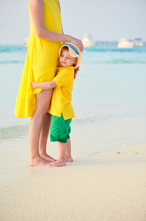 Three year old toddler boy on beach with mother. Summer family vacation at Maldives.の写真素材