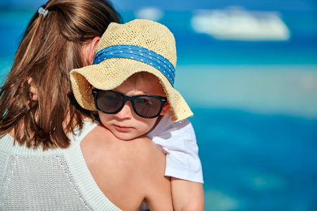 Three year old toddler boy on beach with his mother. Summer family vacation at Maldives.の写真素材