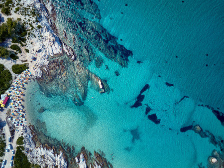 Beautiful beach and rocky coastline top aerial view drone shot, Sithonia, Greeceの写真素材