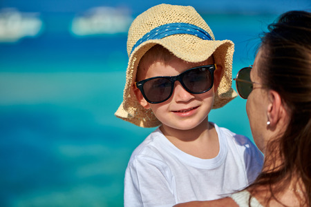 Three year old toddler boy on beach with his mother. Summer family vacation at Maldives.の写真素材