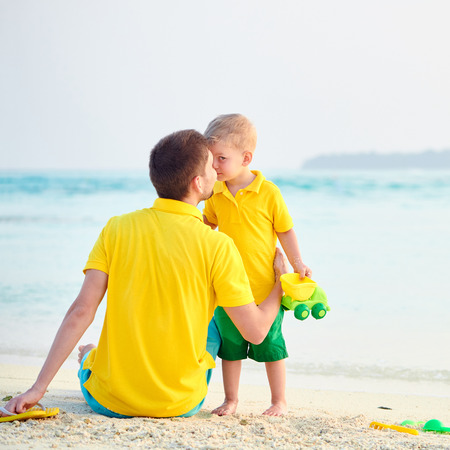 Three year old toddler boy on beach with father. Summer family vacation at Maldives.の写真素材
