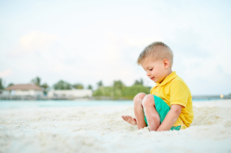 Three year old toddler boy on beach. Summer family vacation at Maldives.の写真素材