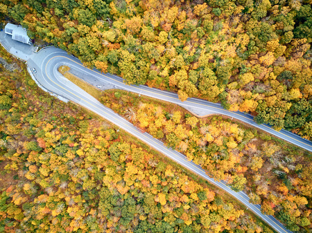 Scenic Mohawk Trail highway hairpin turn in autumn, Massachusetts, USA. Fall in New England. Aerial drone shot.の写真素材