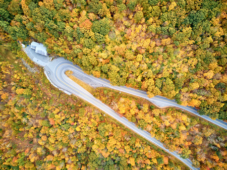Scenic Mohawk Trail highway hairpin turn in autumn, Massachusetts, USA. Fall in New England. Aerial drone shot.の写真素材