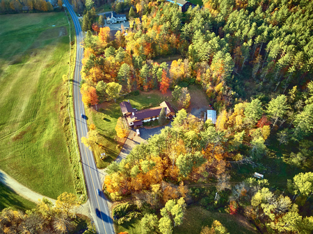 Scenic highway at autumn in New Hampshire, USA. Fall in New England. Aerial drone shot.の写真素材