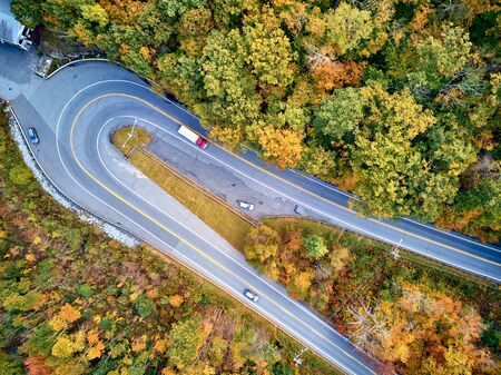 Scenic Mohawk Trail highway hairpin turn in autumn, Massachusetts, USA. Fall in New England. Aerial drone shot.の写真素材