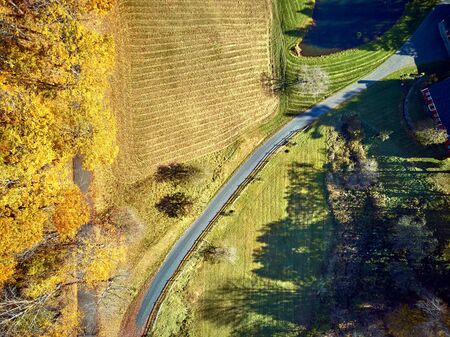 Scenic landscape with farm at autumn in Woodstock, Vermont, USA. Fall in New England. Aerial drone shot.の写真素材