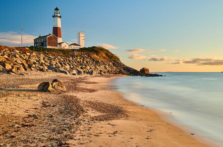 Montauk Lighthouse and beach at sunrise, Long Island, New York, USA.の写真素材