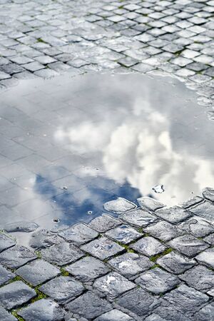 Cobblestone brick paved wet street in Rome, Italyの写真素材