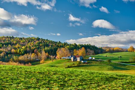 Farm with barn at sunny autumn morning in Vermont, USAの写真素材