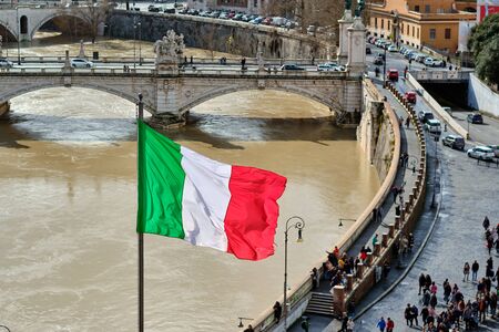 Rome and Tiber river with high water in February and flag of Italyの写真素材