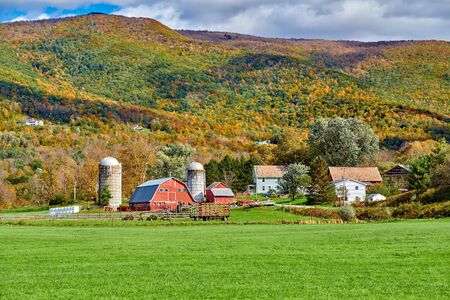 Farm with red barn and silos at sunny autumn day in West Arlington, Vermont, USAの写真素材