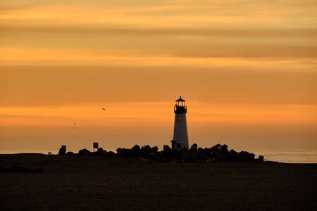 Santa Cruz Breakwater Light (Walton Lighthouse) at sunrise, Pacific coast, California, USAの写真素材
