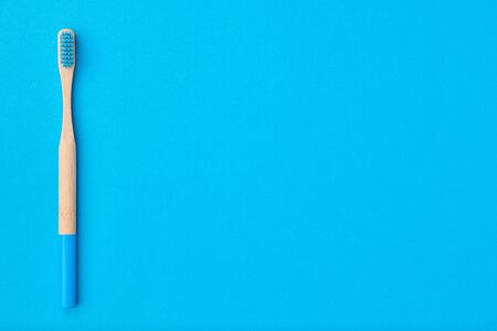 Toothbrush on blue background top view copy space. Tooth care, dental hygiene and health concept.の写真素材