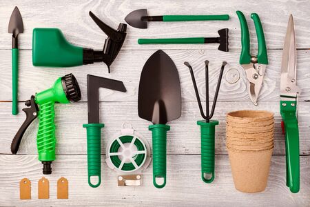 Gardening tools on wooden background flat lay top viewの写真素材
