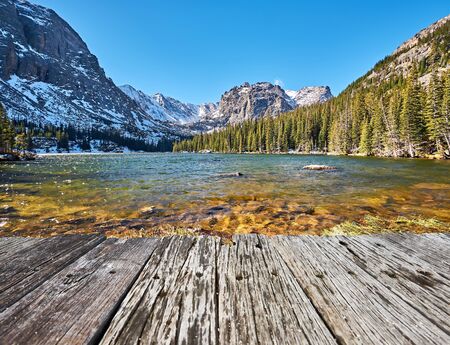 The Loch Lake with rocks and mountains in snow around at autumn. Rocky Mountain National Park in Colorado, USA.の写真素材