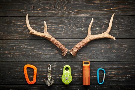 Travel items for hiking tourism still life over wooden background