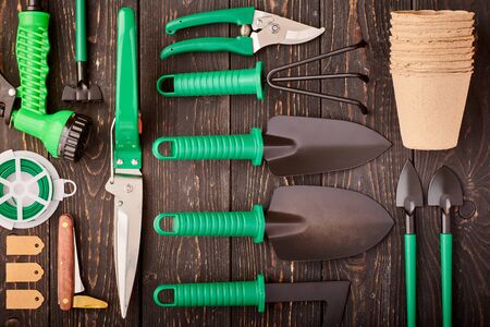 Gardening tools on wooden background flat lay top view の写真素材