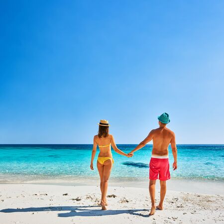 Couple walking on a tropical beach. Perhentian islands, Malaysia. の写真素材