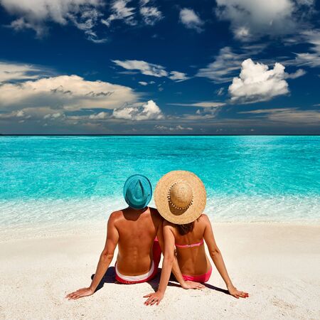 Couple on a tropical beach at Maldivesの写真素材